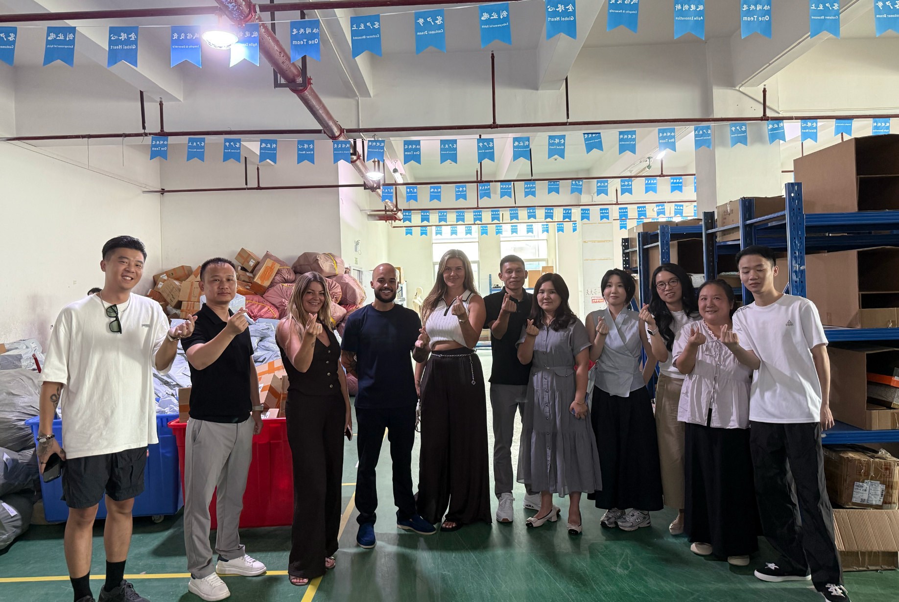 Large group photo with Service Points team visiting our facility