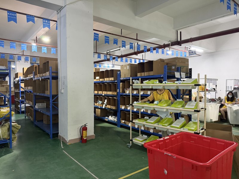 Fulfillant warehouse packing shelves and prepared order materials